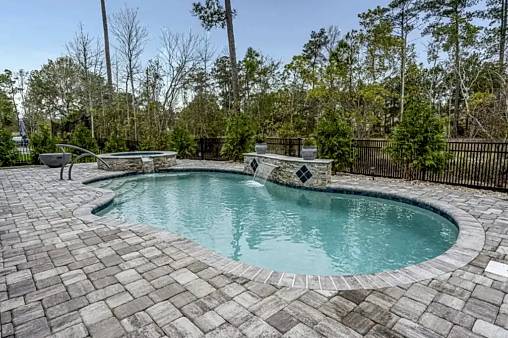 Lux Project 14 custom oasis pool with spa and waterfalls