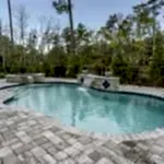 Lux Project 14 custom oasis pool with spa and waterfalls