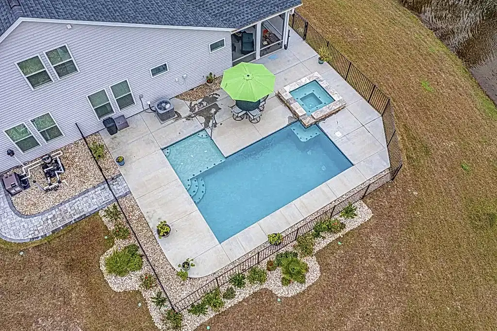 Lux Project 13 custom L shaped pool with spa