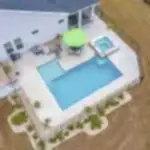 Lux Project 13 custom L shaped pool with spa