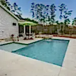 Lux project custom pool and spa with waterfall feature by the lake